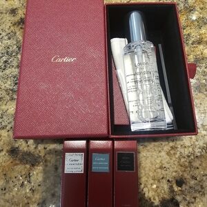 Cartier Fragrance Collection with Red and Silver Accents And Jewlery Cleaner